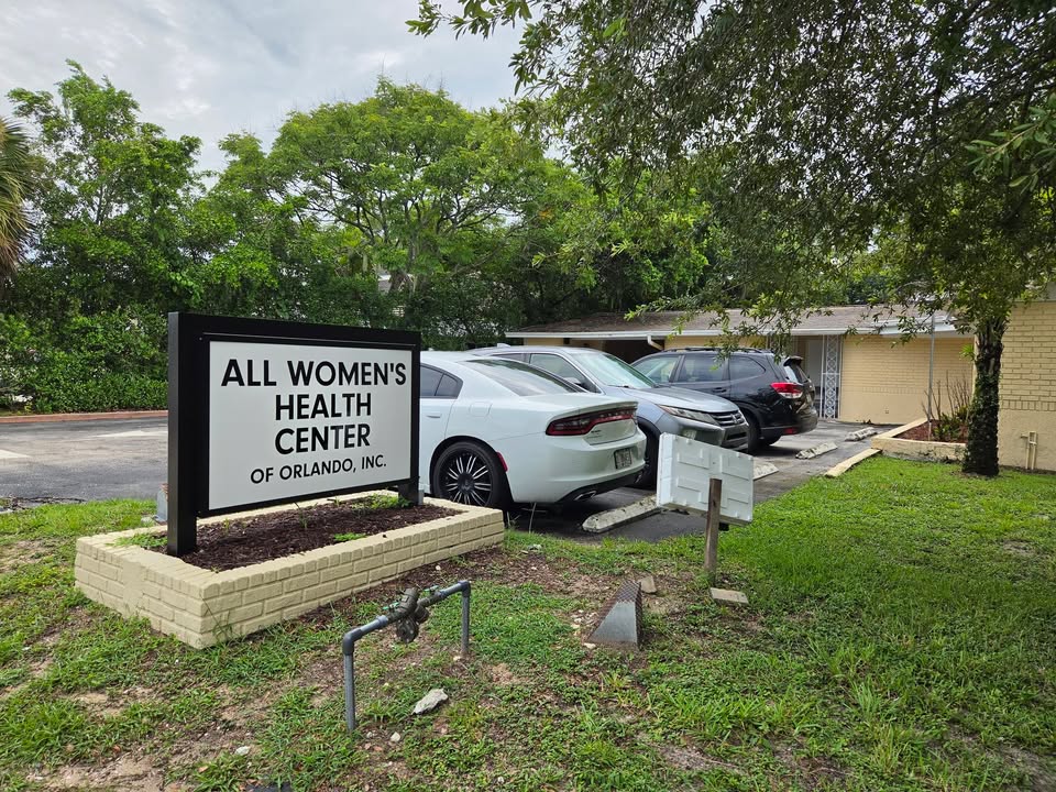 The sign and parking lot outside the All Women's Health Center of Orlando abortion mill, where One Life For Life missionaries preach the Gospel.